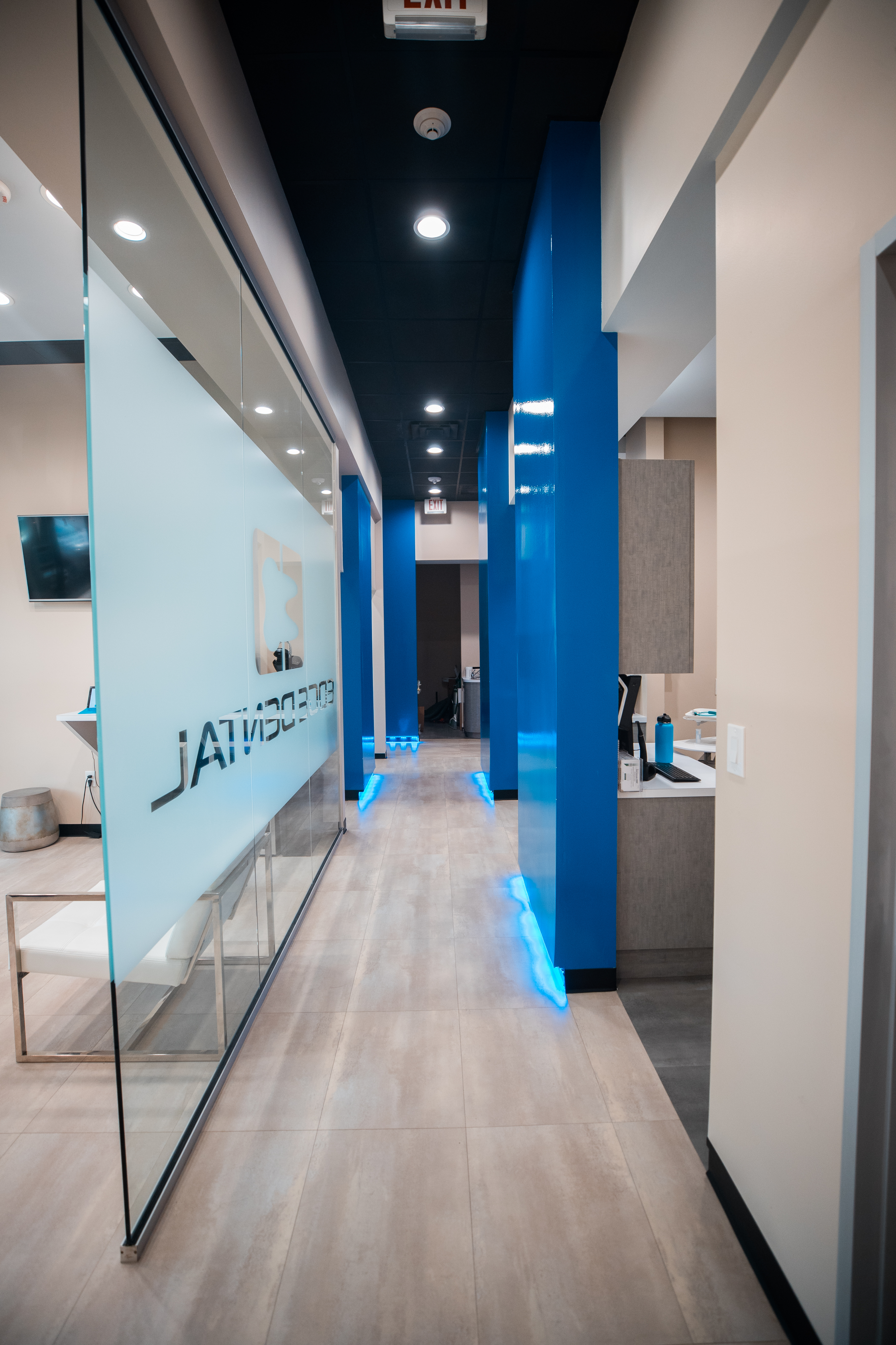 Modern dental consult room with dusk city light through the window